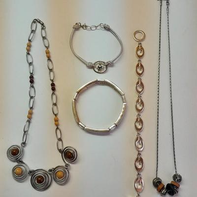 Beaded necklaces and a couple silver toned bracelets.