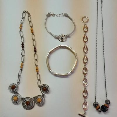 Beaded necklaces and a couple silver toned bracelets.