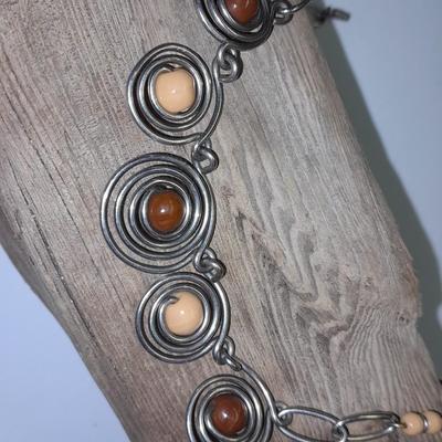 Beaded necklaces and a couple silver toned bracelets.