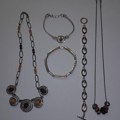 Beaded necklaces and a couple silver toned bracelets.
