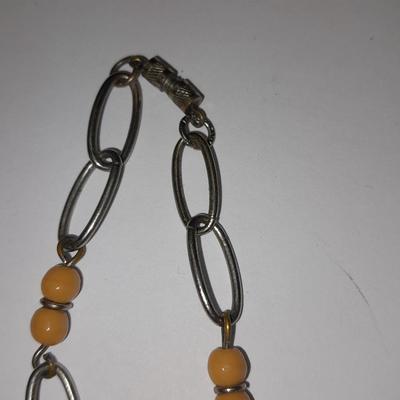 Beaded necklaces and a couple silver toned bracelets.