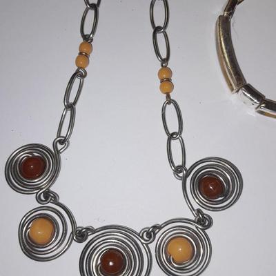 Beaded necklaces and a couple silver toned bracelets.