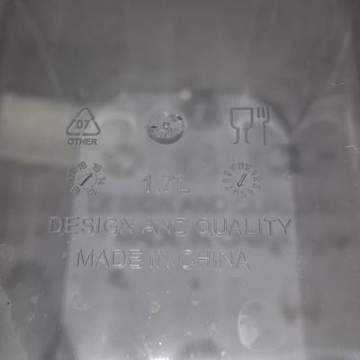 Four wooden bamboo lidded plastic food storage containers with an assortment of Kitchen hand towels