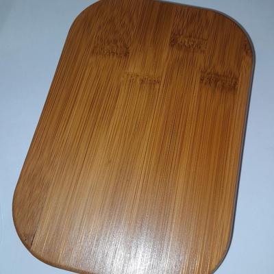 Four wooden bamboo lidded plastic food storage containers with an assortment of Kitchen hand towels