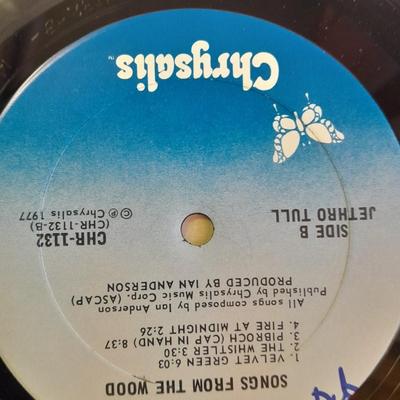 An assortment of collectibles - Jethro Tull Lp = Poster - and books