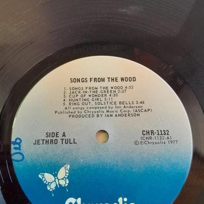 An assortment of collectibles - Jethro Tull Lp = Poster - and books