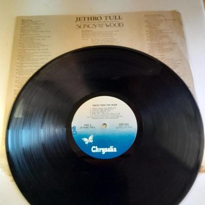 An assortment of collectibles - Jethro Tull Lp = Poster - and books