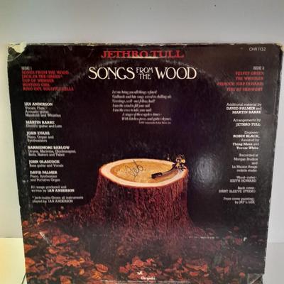 An assortment of collectibles - Jethro Tull Lp = Poster - and books