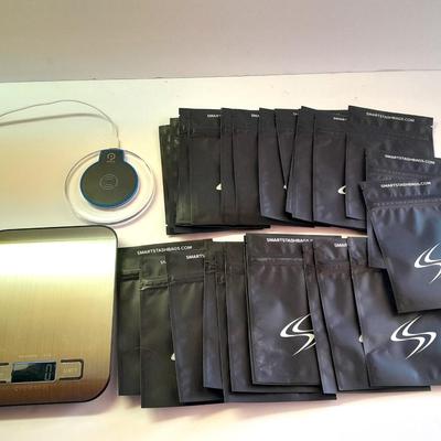 Digital food scale - POM Gear Phone charger - and a few smart stash brand bags.