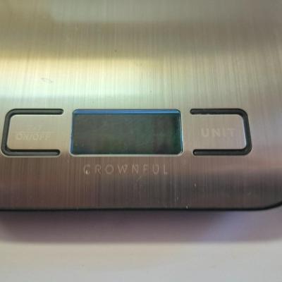 Digital food scale - POM Gear Phone charger - and a few smart stash brand bags.