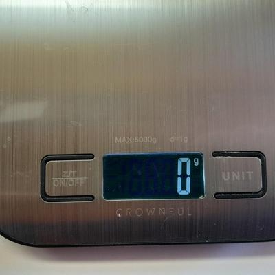 Digital food scale - POM Gear Phone charger - and a few smart stash brand bags.