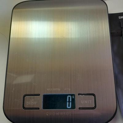 Digital food scale - POM Gear Phone charger - and a few smart stash brand bags.