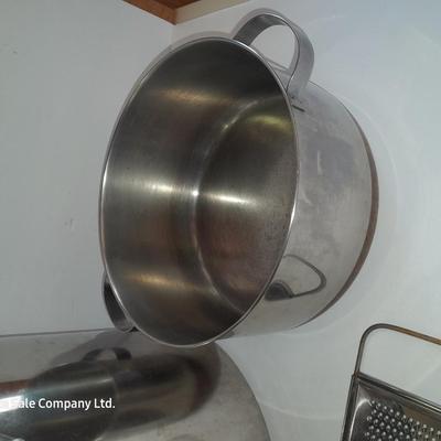 Rever ware stainless pot with larger stock pot and a metal bowl-hung cheese grater