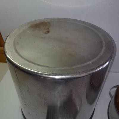 Rever ware stainless pot with larger stock pot and a metal bowl-hung cheese grater