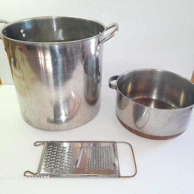 Rever ware stainless pot with larger stock pot and a metal bowl-hung cheese grater