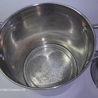 Rever ware stainless pot with larger stock pot and a metal bowl-hung cheese grater
