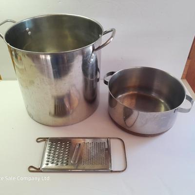 Rever ware stainless pot with larger stock pot and a metal bowl-hung cheese grater