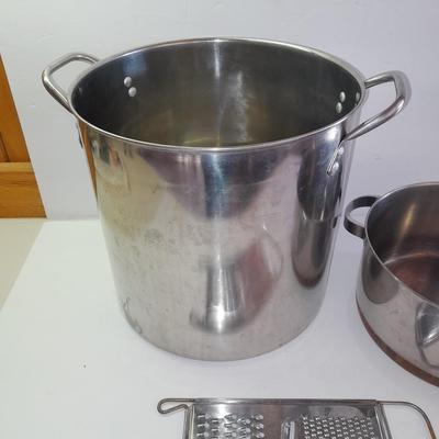 Rever ware stainless pot with larger stock pot and a metal bowl-hung cheese grater