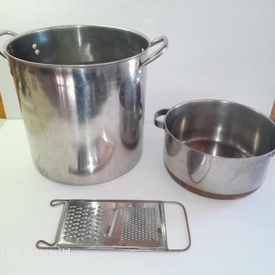 Rever ware stainless pot with larger stock pot and a metal bowl-hung cheese grater