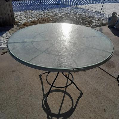 47" Glass topped metal frame patio table