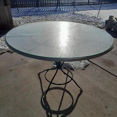 47" Glass topped metal frame patio table