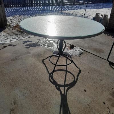 47" Glass topped metal frame patio table