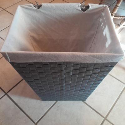 Woven laundry hamper with inside lining bag