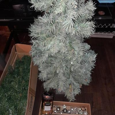 Two faux Christmas trees - ornaments and two candles