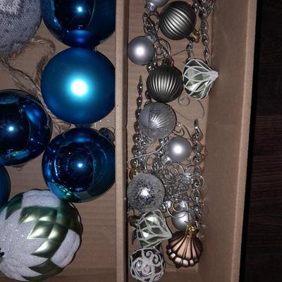 Two faux Christmas trees - ornaments and two candles