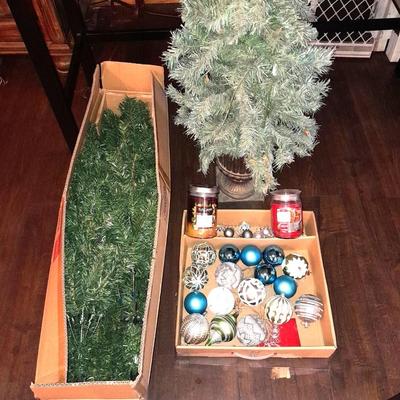 Two faux Christmas trees - ornaments and two candles