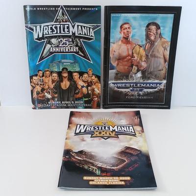 LOT 5L: Wrestling Collection- Several Wrestlemania Booklets Along with Handbound Wrestling Histories and More