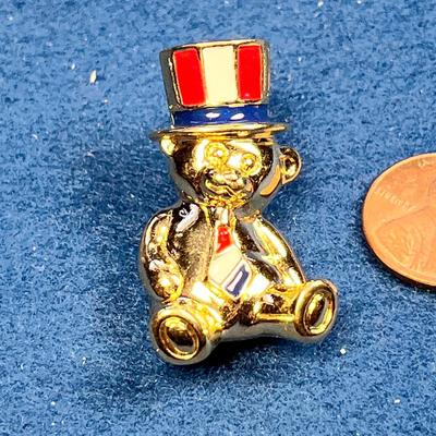 ENAMELED 3-D TEDDY BEAR PIN WITH RED, WHITE, BLUE STRIPED HAT AND TIE 