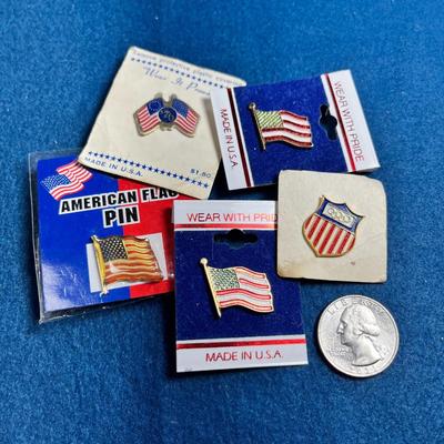 GROUP OF 5 ASSORTED ENAMELED U.S. FLAG PINS, ALL NEW ON CARDS