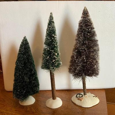 Three large green trees