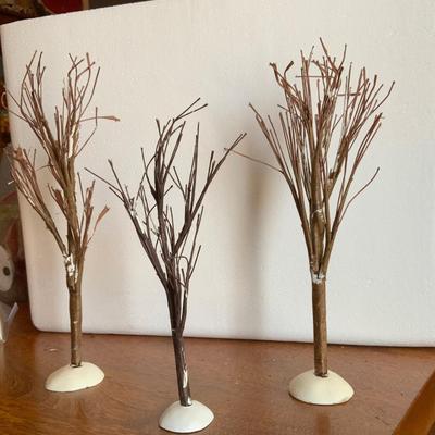 Three tall bare trees