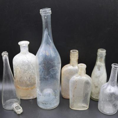 Variety (7) Antique Early Clear Glass Bottles