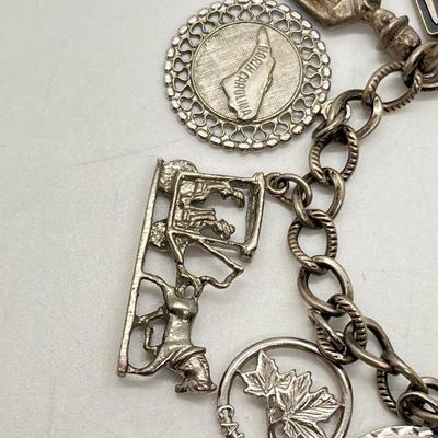 LOT 313J: Silver Charm Bracelet: All Marked Sterling - 40.8 Grams