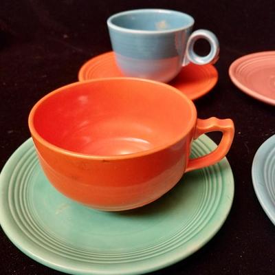 GENUINE FIESTA SAUCERS AND UNMARKED COFFEE CUPS