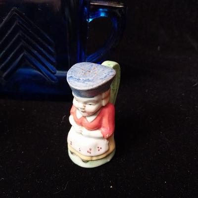 TOBY STYLE SALT/PEPPER SHAKERS AND A BLUE GLASS CREAMER