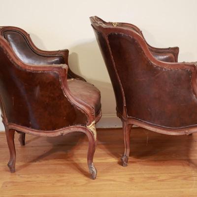 Two Antique Project Leather Embossed Chairs (see description)