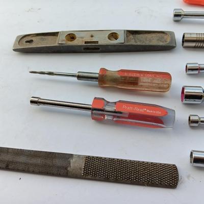 Assortment of Nut drivers with a level and a rasp