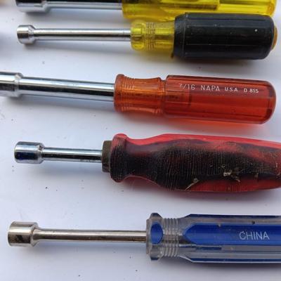 Assortment of Nut drivers with a level and a rasp