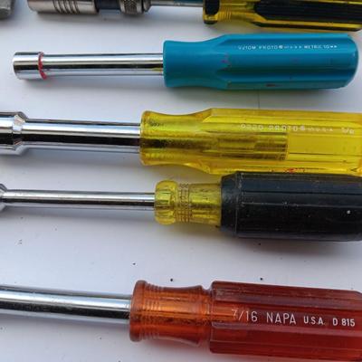 Assortment of Nut drivers with a level and a rasp