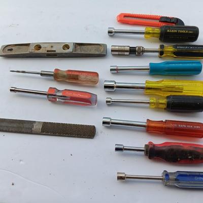 Assortment of Nut drivers with a level and a rasp