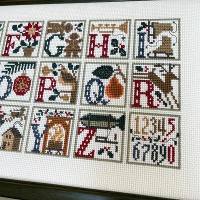 2 framed cross stitch pictures.