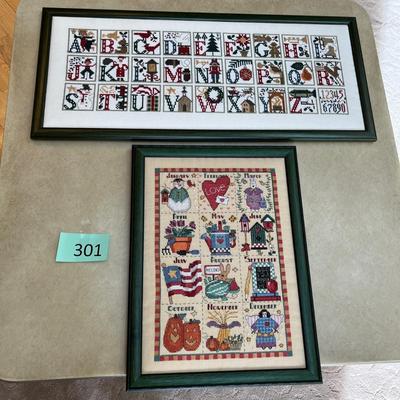 2 framed cross stitch pictures.