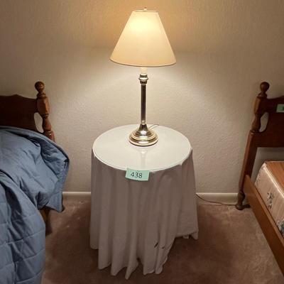 3 leg table with brass lamp