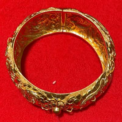 24 Karat gold ladies bangle. 2.9 inches wide. 1.4 dept. 58.1 grams.