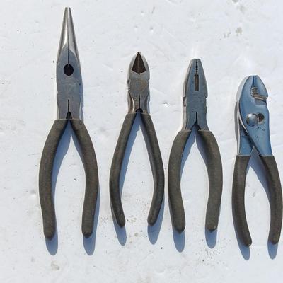 Assortment of black handled Pliers