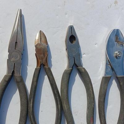 Assortment of black handled Pliers
